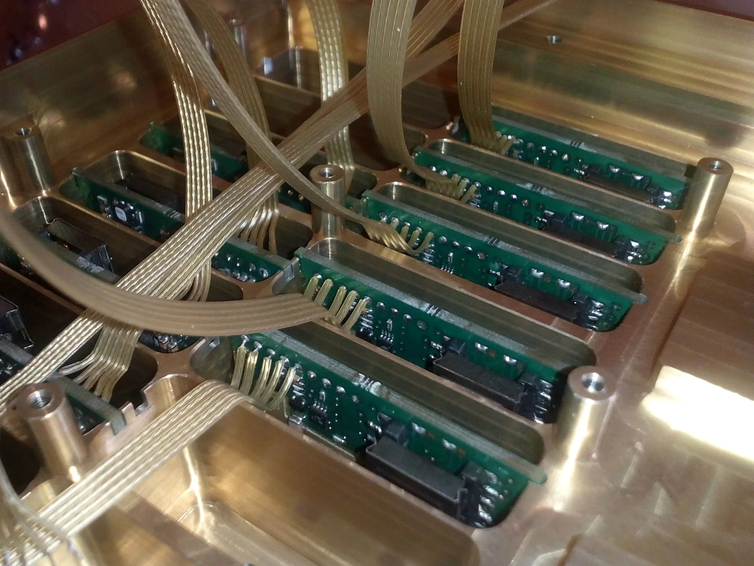 Inside view of I-Conomy custom HV system — rows of HV modules in precision-machined aluminium chassis